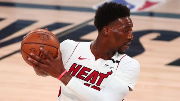 Miami Heat forward Bam Adebayo controls the ball against the Boston Celtics in the Eastern Conference Finals of the 2020 NBA Playoffs at AdventHealth Arena.